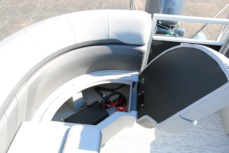 Slide: The Image of 2026 Bennington 22SX Stern Radius boat with open storage compartment and seating. - 36
