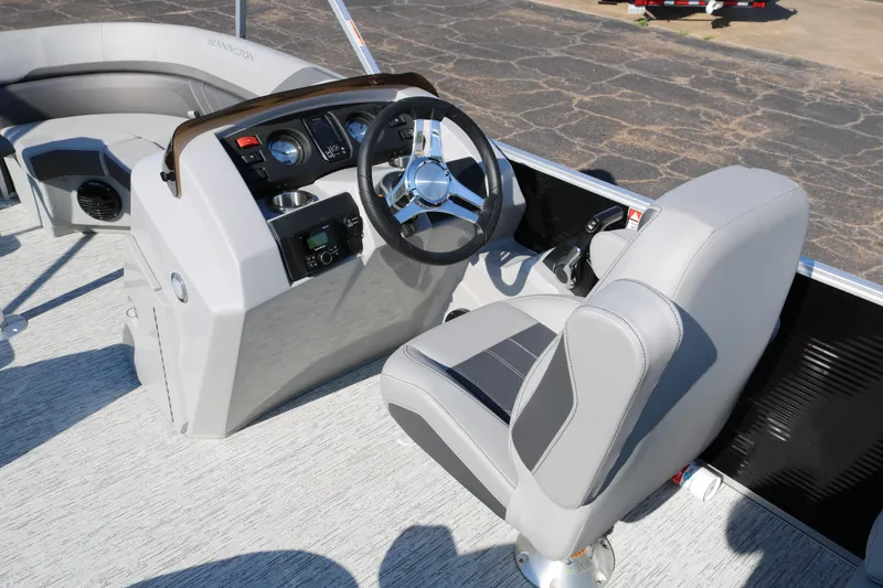 Slide: The Image of 2026 Bennington 22SX Stern Radius boat interior with steering wheel and seating. - 37