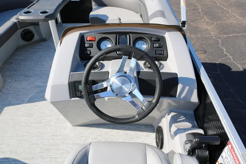 Slide: The Image of 2026 Bennington 22SX Stern Radius boat dashboard with steering wheel and controls. - 38