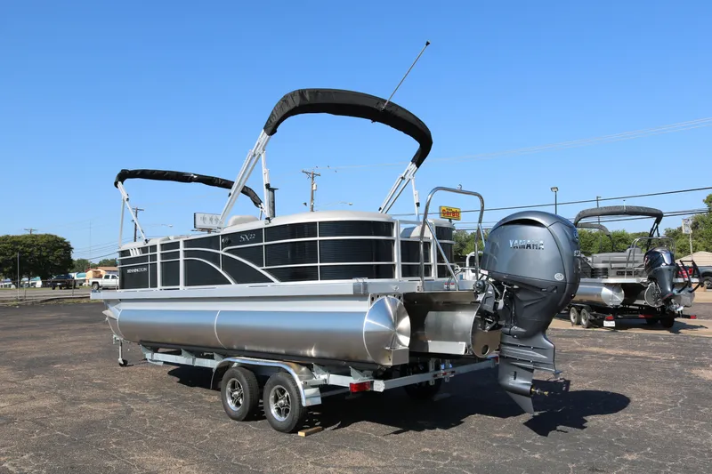 Slide: The Image of 2026 Bennington 22SX Stern Radius pontoon boat with Yamaha outboard motor on trailer. - 5