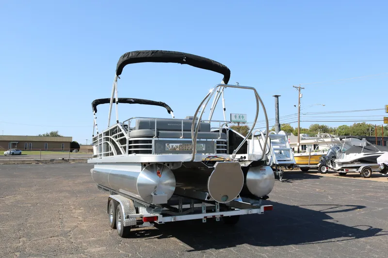 Slide: The Image of 2026 Bennington 22SX Stern Radius pontoon boat with Yamaha 150 engine on trailer. - 6