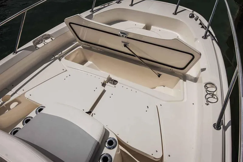 Slide: The Image of Manufacturer Provided Image: 2017 Boston Whaler 210 Dauntless boat with open storage compartment. - 10