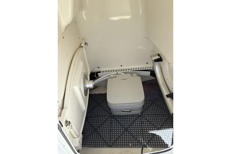 Slide: The Image of Interior of 2017 Boston Whaler 210 Dauntless boat with portable toilet. - 4