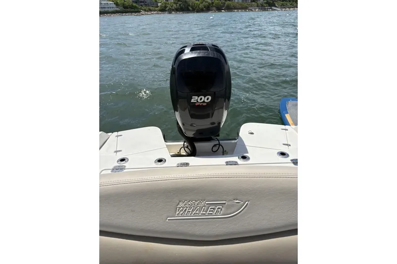 Slide: The Image of 2017 Boston Whaler 210 Dauntless boat with 200 HP engine on water. - 5