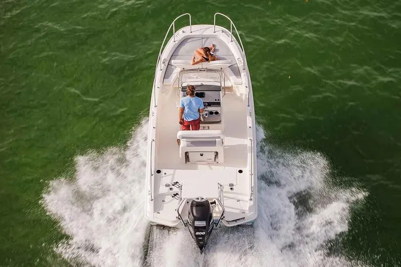 Slide: The Image of Manufacturer Provided Image: 2017 Boston Whaler 210 Dauntless boat cruising on green water. - 8