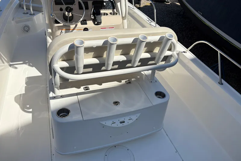 Slide: The Image of 2024 Boston Whaler 210 Montauk boat interior with rod holders and steering console. - 5