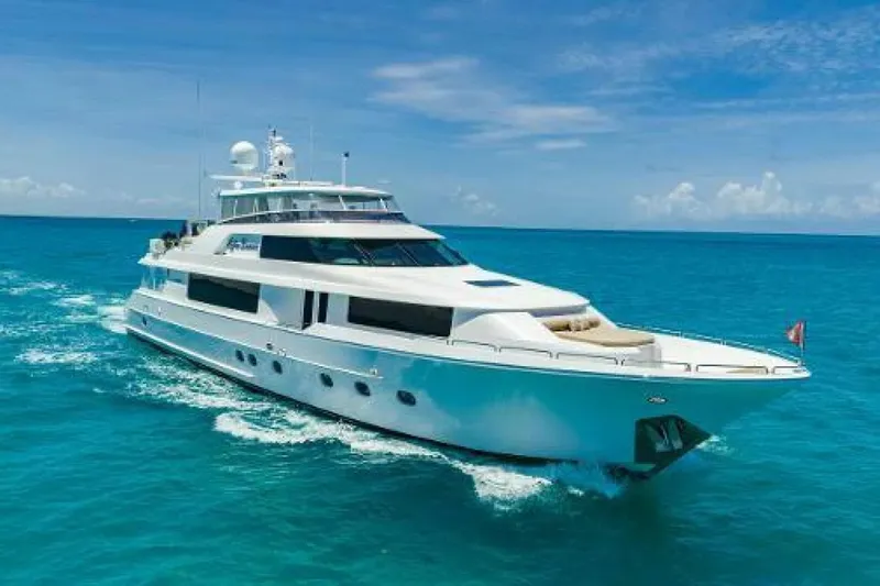 The Image of Luxurious 2014 Westport 112 yacht cruising on open water under clear skies. - 0
