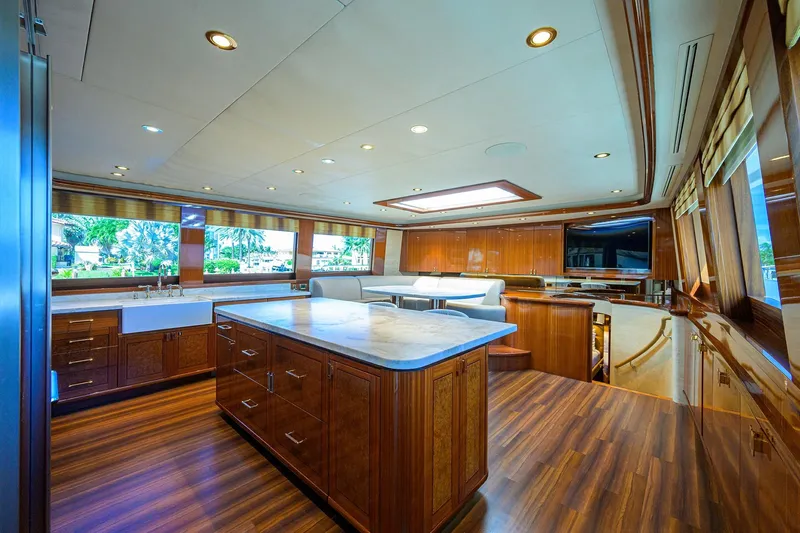Slide: The Image of Luxurious interior of 2014 Westport 112 yacht with modern kitchen and dining area. - 17