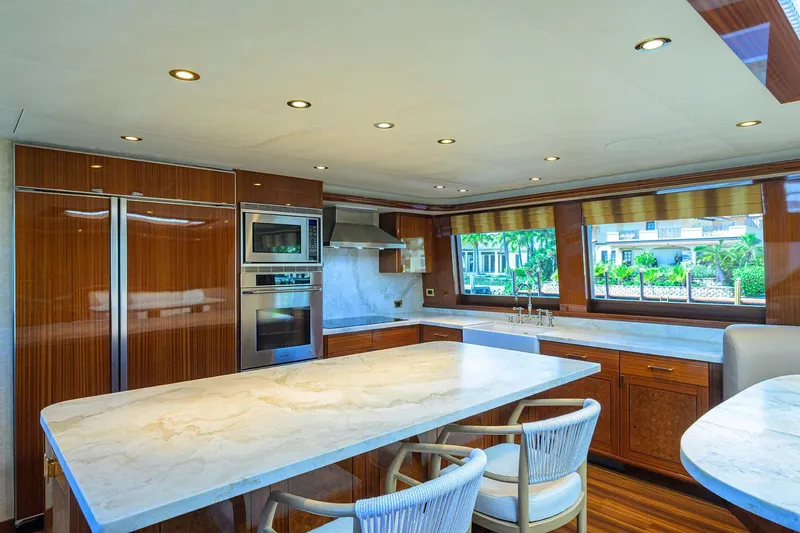 Slide: The Image of Luxurious kitchen interior on 2014 Westport 112 yacht with marble countertops and large windows. - 19