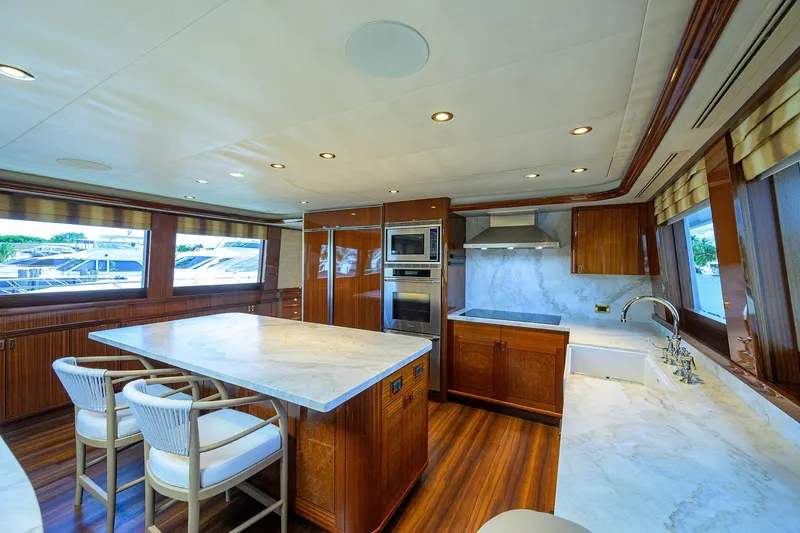 Slide: The Image of Luxurious interior of 2014 Westport 112 yacht with elegant wood finishes and modern amenities. - 21