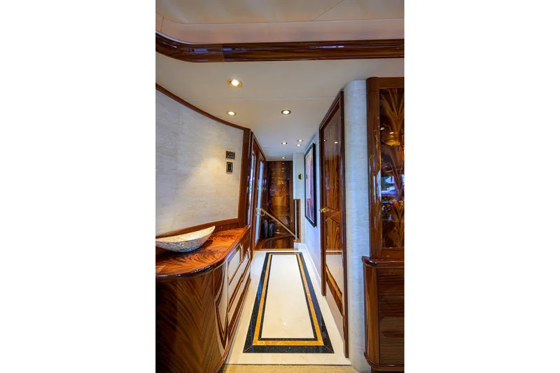 Slide: The Image of Luxurious bedroom interior on 2014 Westport 112 yacht, featuring elegant wood finishes and modern lighting. - 28
