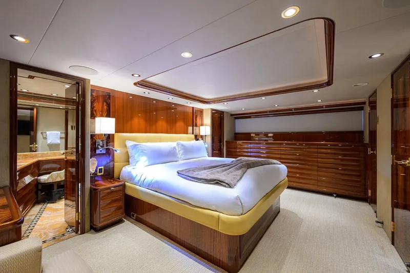 Slide: The Image of Luxurious interior of 2014 Westport 112 yacht with polished wood cabinetry and elegant lighting. - 31