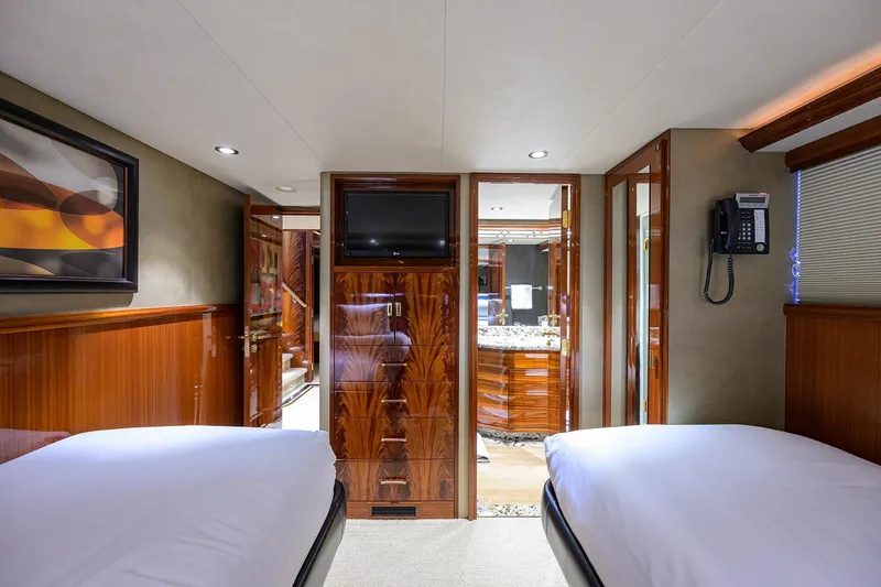 Slide: The Image of Luxurious bathroom interior on 2014 Westport 112 yacht with marble countertop and wood finishes. - 39