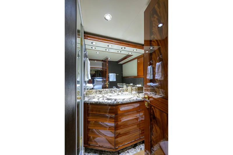 Slide: The Image of Luxurious bathroom in 2014 Westport 112 yacht with marble accents and glass shower. - 40