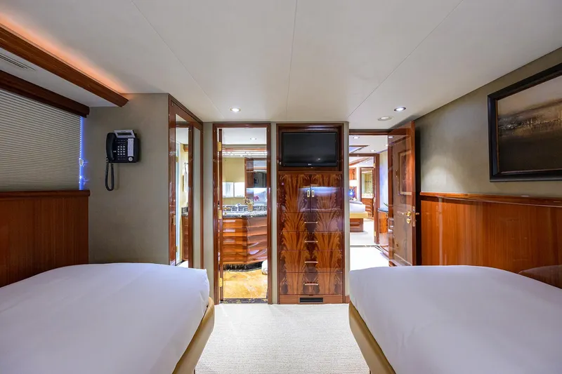 Slide: The Image of Luxurious bathroom in 2014 Westport 112 yacht with marble countertop and elegant wood finishes. - 43