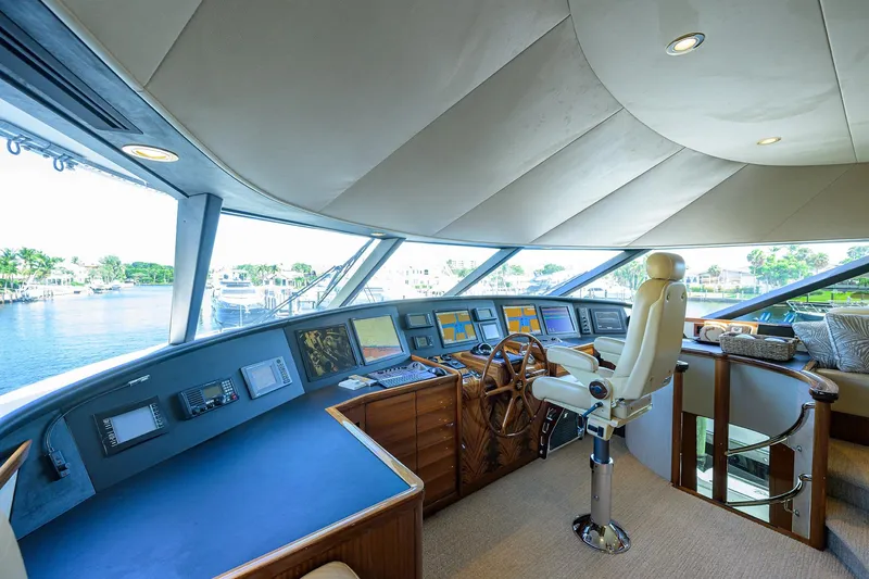 Slide: The Image of Luxurious 2014 Westport 112 yacht helm with advanced navigation systems and captain's chair. - 47
