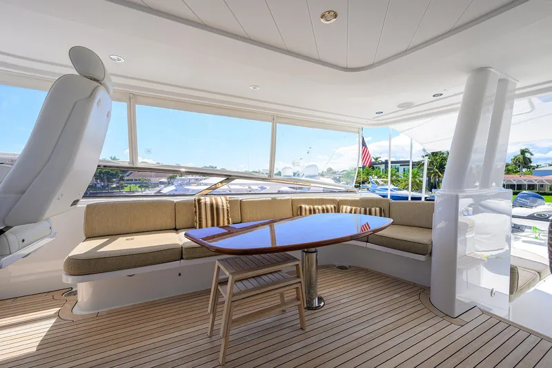 Slide: The Image of Luxurious interior of 2014 Westport 112 yacht with elegant seating and helm chairs. - 56