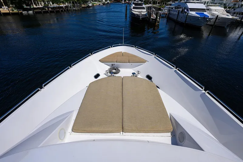Slide: The Image of Luxurious 2014 Westport 112 yacht deck with sun pads, overlooking waterfront homes. - 62