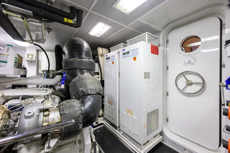 Slide: The Image of Engine room of 2014 Westport 112 yacht, featuring advanced machinery and equipment. - 68