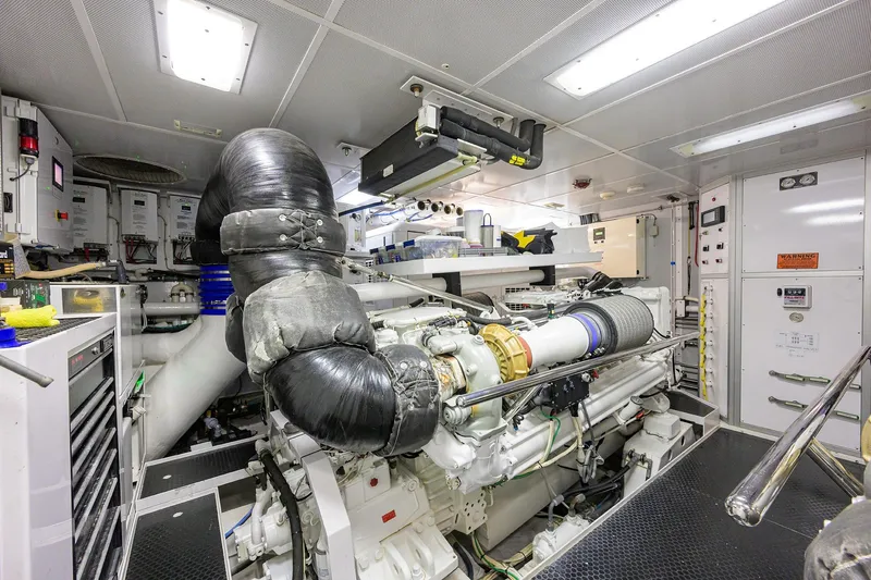 Slide: The Image of Engine room of 2014 Westport 112 yacht, featuring machinery and control systems. - 69