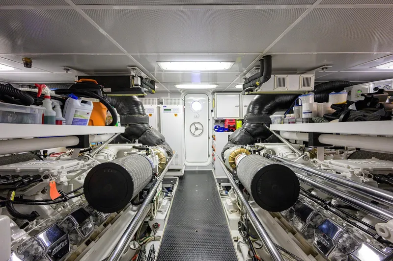 Slide: The Image of Engine room of 2014 Westport 112 yacht, featuring control panels and machinery. - 72
