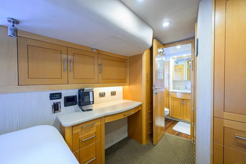 Slide: The Image of Luxurious cabin interior of 2014 Westport 112 yacht, featuring cozy bed and modern amenities. - 76