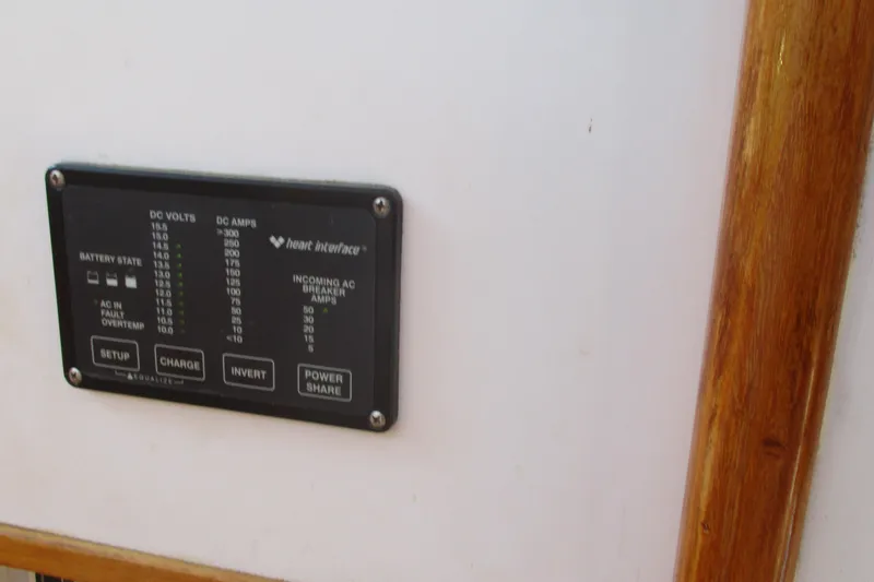 Slide: The Image of Electrical control panel on 1955 Custom Gaff Rigged Ketch, featuring battery and power settings. - 13