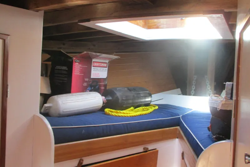 Slide: The Image of Interior of 1955 Custom Gaff Rigged Ketch with skylight, cushions, and nautical equipment. - 20