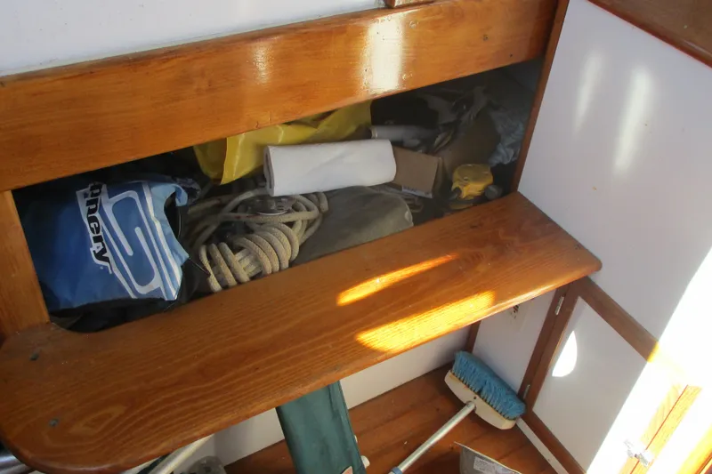 Slide: The Image of Storage area on 1955 Custom Gaff Rigged Ketch with ropes and cleaning supplies. - 21