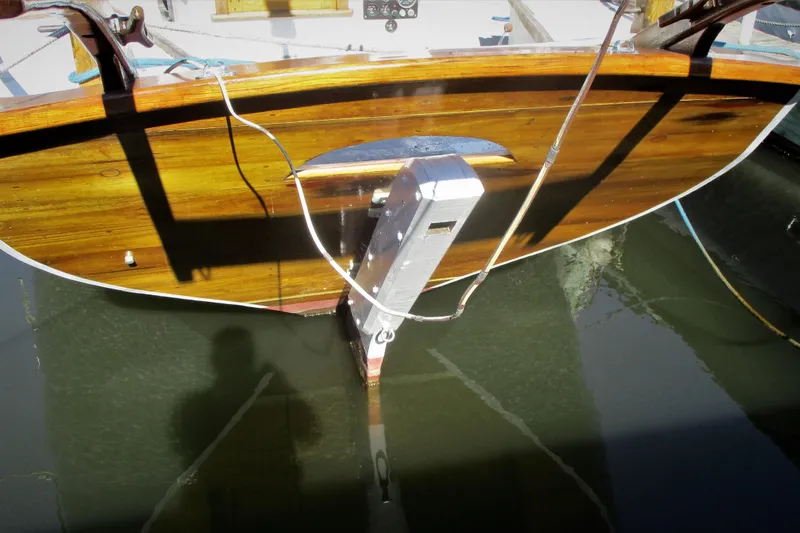 Slide: The Image of 1955 Custom Gaff Rigged Ketch with wooden hull and keel in marina. - 3