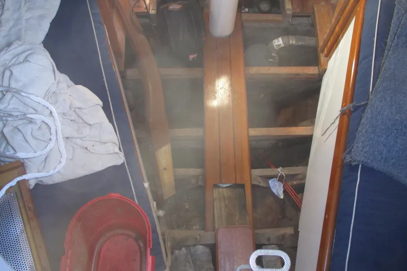 Slide: The Image of Interior view of 1955 Custom Gaff Rigged Ketch, showing wooden flooring and nautical equipment. - 37