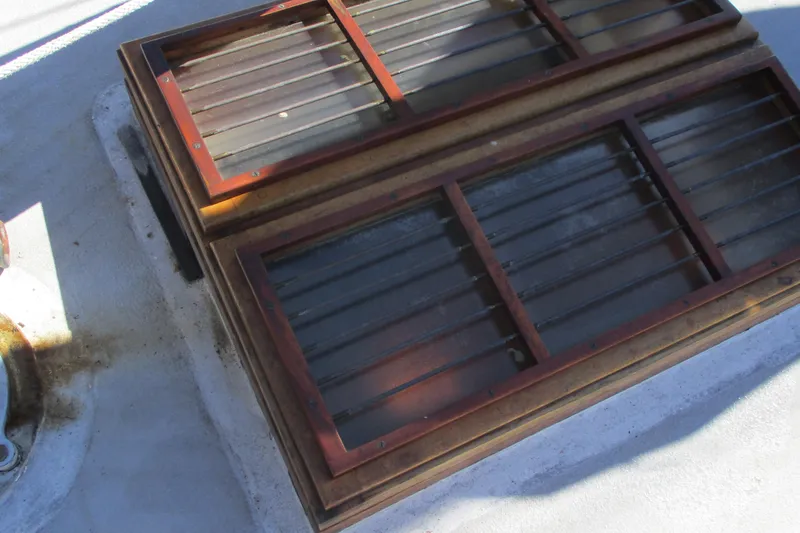 Slide: The Image of Wooden hatch on 1955 Custom Gaff Rigged Ketch, showcasing classic nautical design. - 40