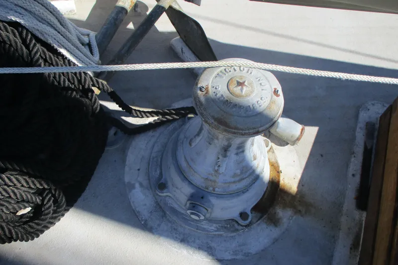 Slide: The Image of Winch on 1955 Custom Gaff Rigged Ketch with coiled ropes on deck. - 41