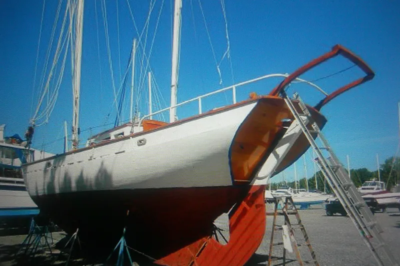 Slide: The Image of 1955 Custom Gaff Rigged Ketch on dry dock, showcasing full keel design. - 5