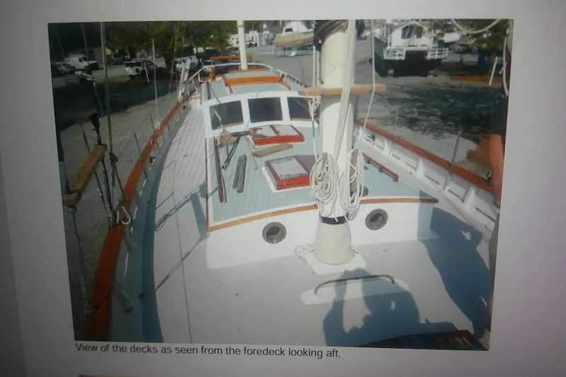 Slide: The Image of 1955 Custom Gaff Rigged Ketch foredeck view, showcasing full keel design and rigging details. - 9