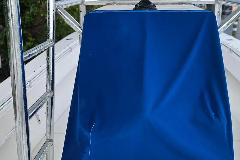 Slide: The Image of 2002 Contender 31 Open boat deck with stainless steel fittings and clean white surface. - 11