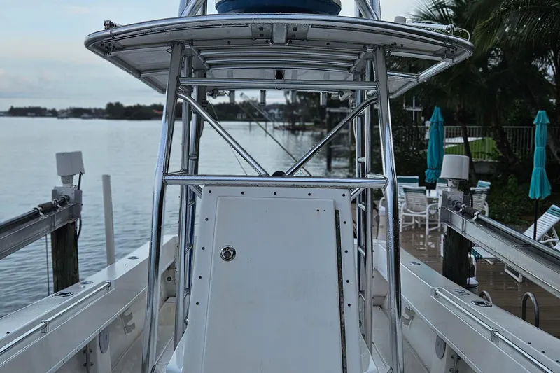 Slide: The Image of 2002 Contender 31 Open boat deck with blue cover and stainless steel fittings. - 14