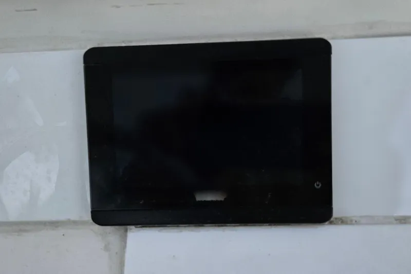 Slide: The Image of Blue fabric cover on a 2002 Contender 31 Open boat seat. - 17