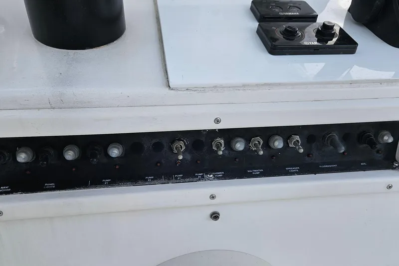 Slide: The Image of Yamaha control panel on 2002 Contender 31 Open boat dashboard. - 20