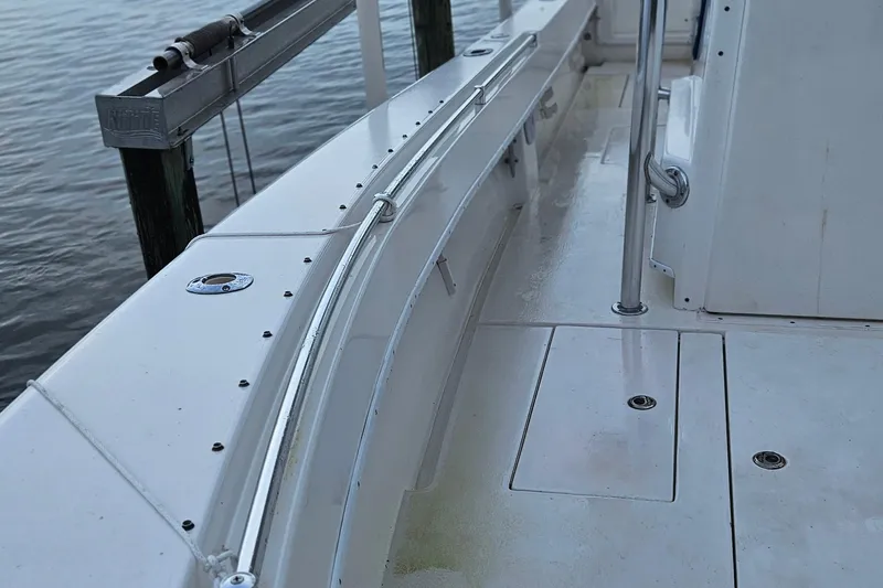 Slide: The Image of Control panel of a 2002 Contender 31 Open boat with various switches and dials. - 21