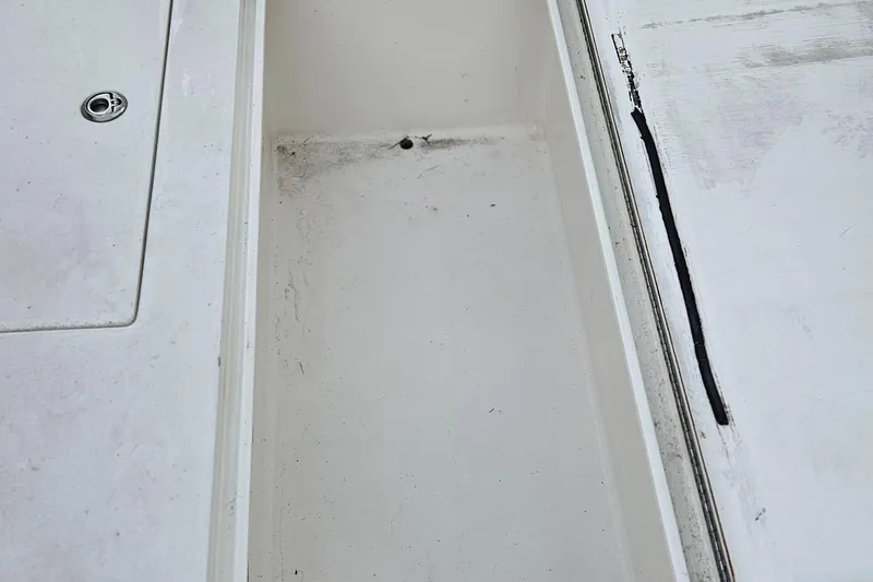 Slide: The Image of Open storage compartment on 2002 Contender 31 Open boat with gear inside. - 27