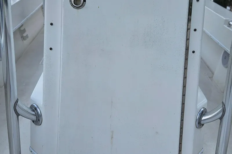 Slide: The Image of 2002 Contender 31 Open boat storage compartment, showing interior details and wear. - 28