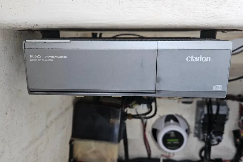 Slide: The Image of 2002 Contender 31 Open boat interior with stainless steel handrails and white paneling. - 29