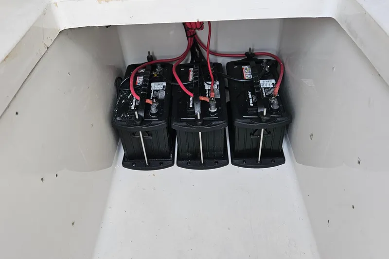 Slide: The Image of Hydraulic pump system in a 2002 Contender 31 Open boat, with wiring and connectors. - 33