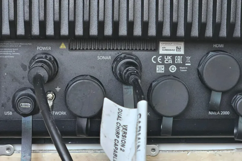 Slide: The Image of 2002 Contender 31 Open boat wiring and electronics setup with Fusion marine speaker. - 36