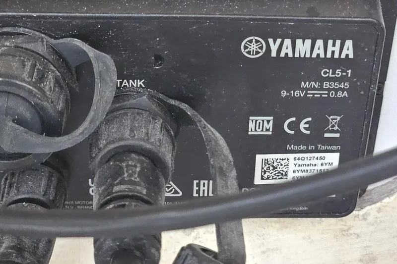 Slide: The Image of Back panel of a marine device with various ports and cables, including power and sonar connections. - 37