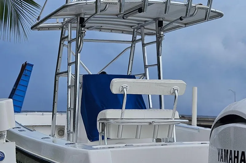 Slide: The Image of Twin Yamaha outboard engines on a 2002 Contender 31 Open boat at a dock. - 4