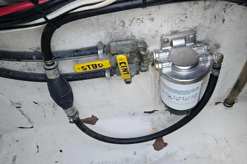 Slide: The Image of Fuel system components in a 2002 Contender 31 Open boat. - 43