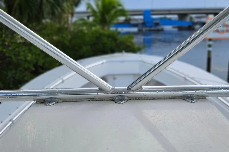 Slide: The Image of 2002 Contender 31 Open boat deck with metal fittings and textured surface. - 47