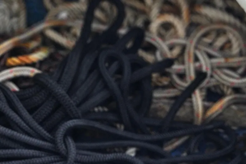 Slide: The Image of Coiled ropes in storage compartment of 2002 Contender 31 Open boat. - 62